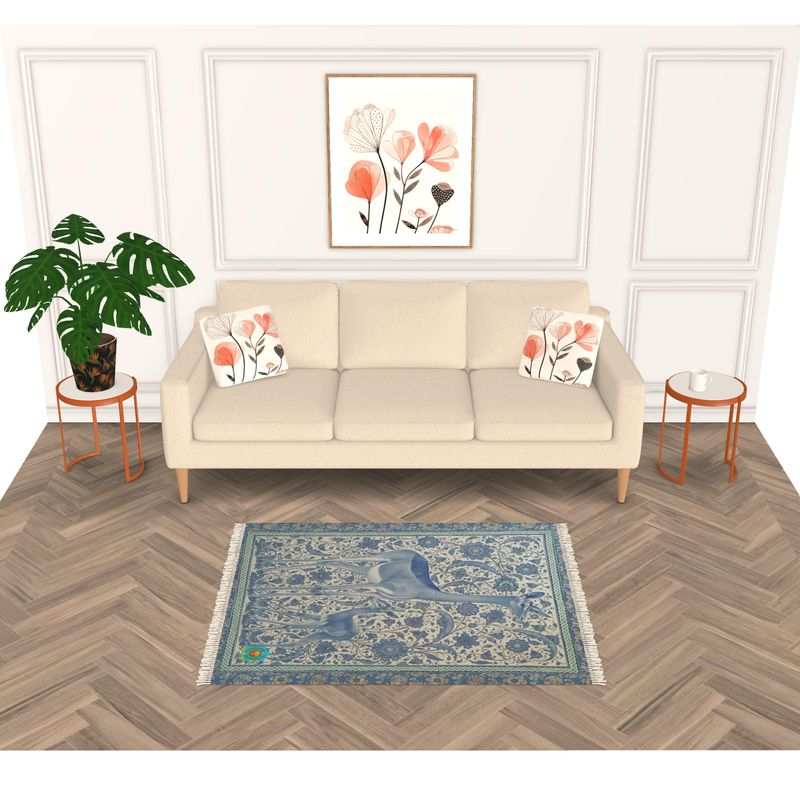 A minimalist living room showcases a beige sofa with floral pillows, two small round side tables—one with a potted plant—and framed floral artwork above. A beautiful handmade rug enhances the wooden herringbone floor, adding texture and charm to the space.