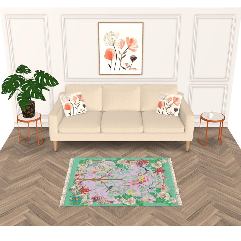 A minimalist living room features a beige sofa with floral cushions on a vibrant handmade rug. Two wooden side tables and a potted plant add charm, while a floral painting on the paneled wall above enhances elegance.