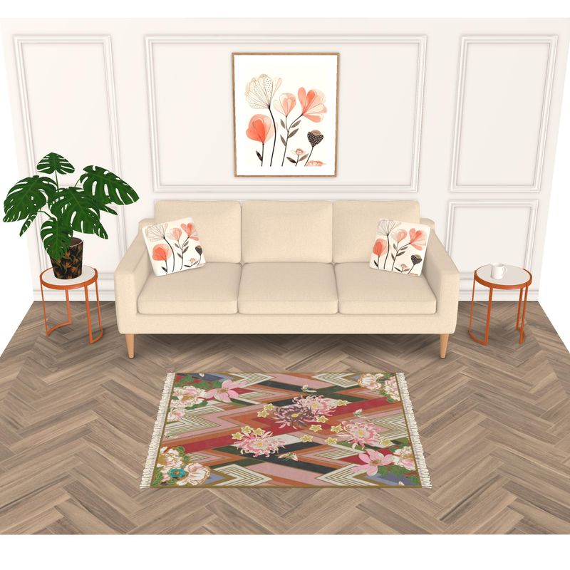 A modern living room includes a beige sofa with floral pillows, a potted plant on a side table, and a large floral painting above. A handmade geometric print velvet rug adds vibrance to the herringbone wooden floor.