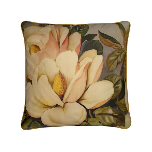 The Floris printed cushion features a detailed close-up of two magnolia flowers with pale yellow petals and lush green leaves, set against a soft backdrop. This item combines custom artwork with luxury duck feather filling for an elegant touch.