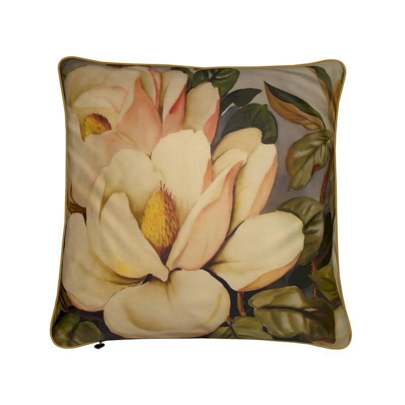 The Floris decorative throw pillow showcases custom art of a magnolia bloom in pastel tones with green leaves on a gray background. This square pillow, featuring piped edges, is filled with luxurious duck feathers for added comfort.