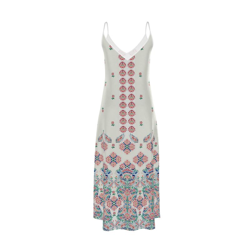 The "Hello, World!" slip dress features a sleeveless design with a v-neckline and thin straps. It showcases a light green fabric adorned with intricate pink, blue, and purple floral and geometric patterns cascading down the front.