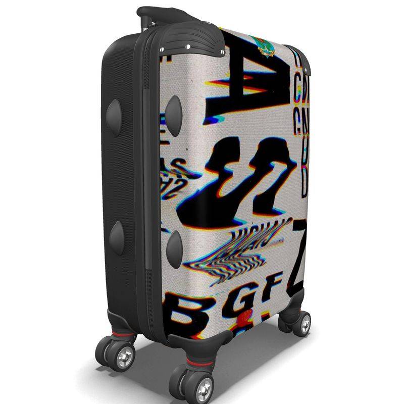 ChromaticSuitcase designer suitcase with bold, glitch-style typography print on hard shell. Stylish and durable for modern travel needs.