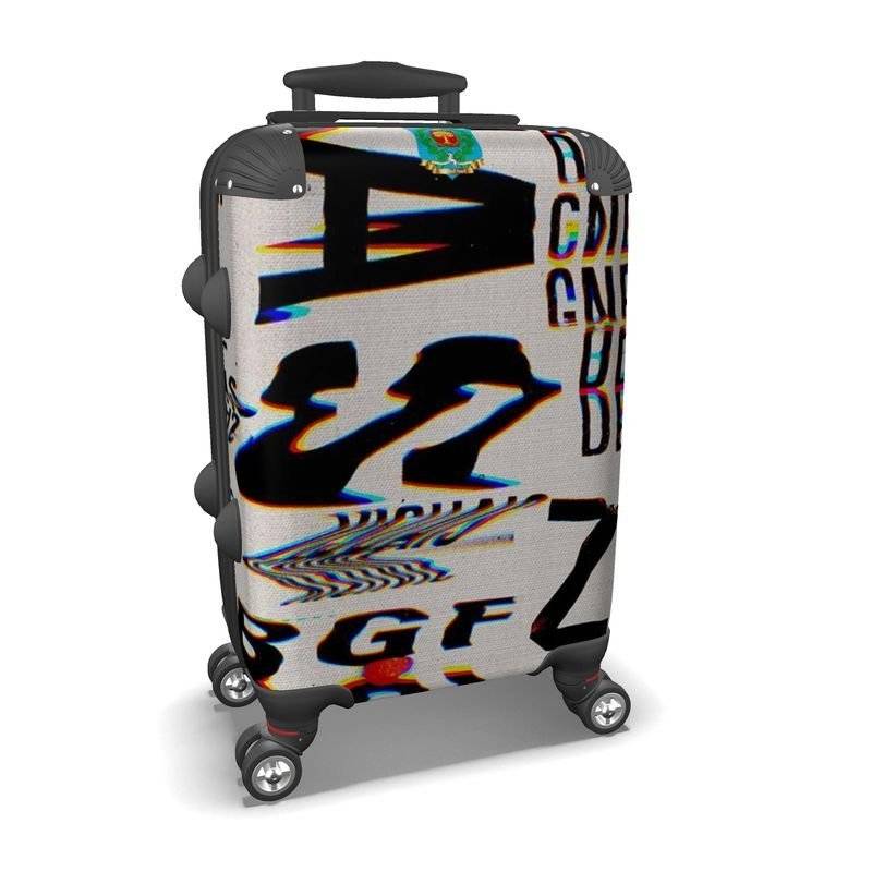 ChromaticSuitcase designer suitcase with bold, glitch-style typography print on hard shell. Stylish and durable for modern travel needs.