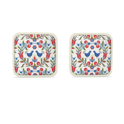Lullaby of Birdland - Designer Pot Holder Set – Handmade, Heat-Resistant, Dual-Use with folk-art bird and floral pattern in red, blue, and green. Set of 2 with cream trim.